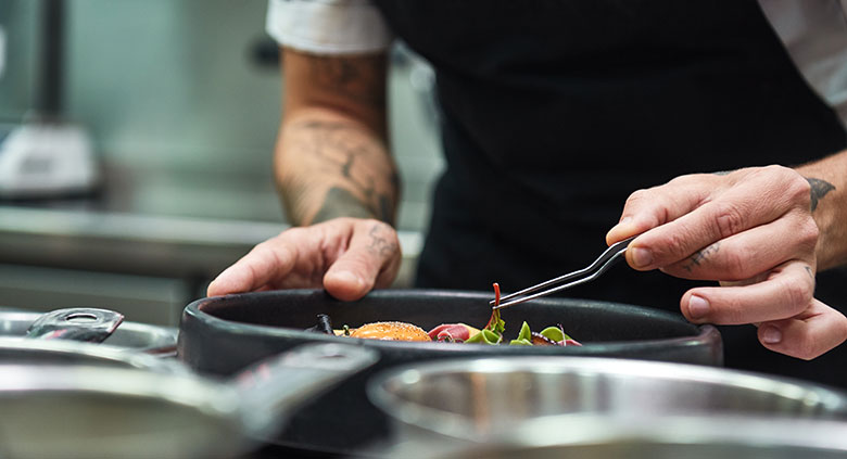 Chef presenting a salad